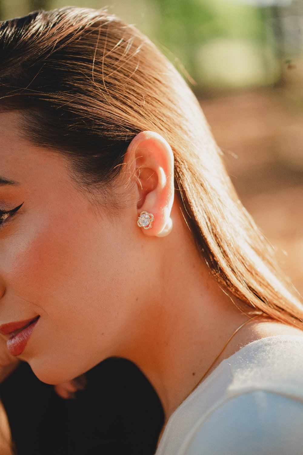 BRINCO DE TREVO COM ZIRCÔNIA E PEROLA 2 EM 1 FOLHEADO A OURO 18K