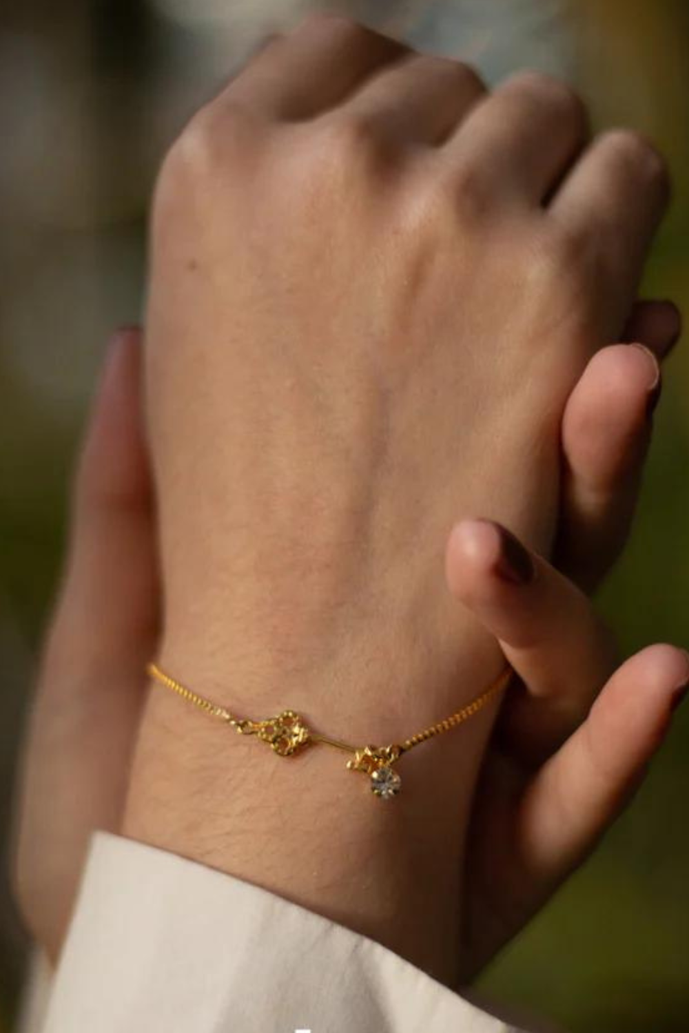 PULSEIRA COM CHAVE E ZIRCONIA FOLHEADO A OURO 18K