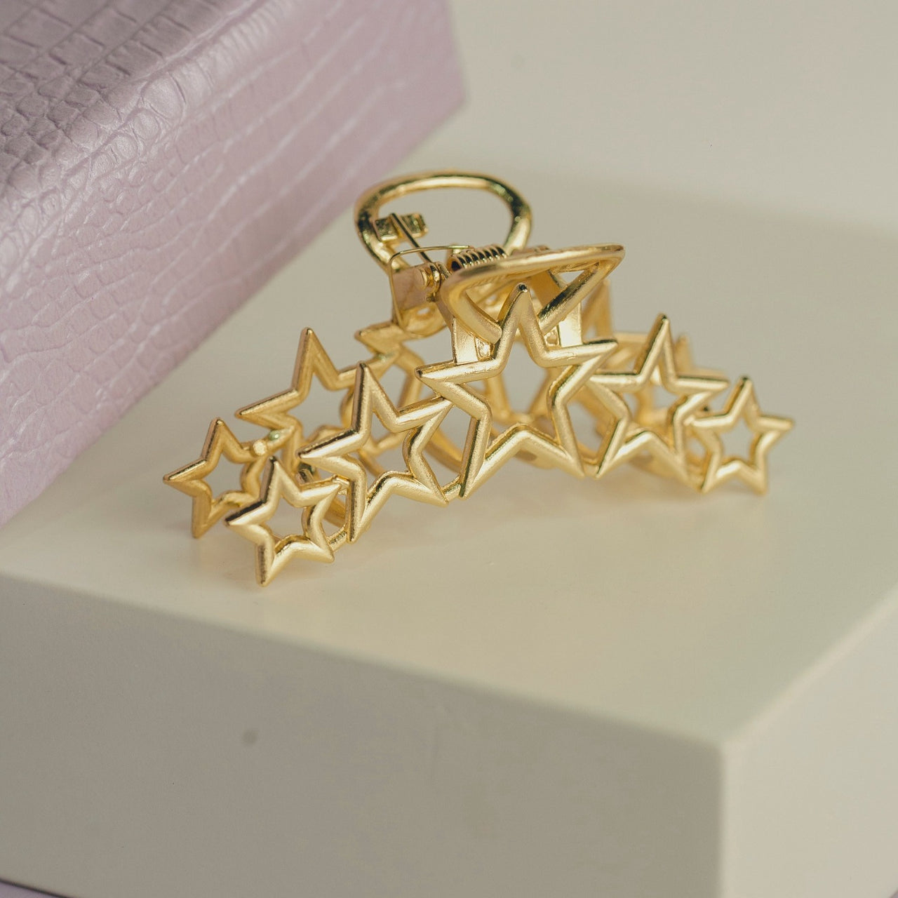 PRESILHA ESTRELA METAL OI FOFA