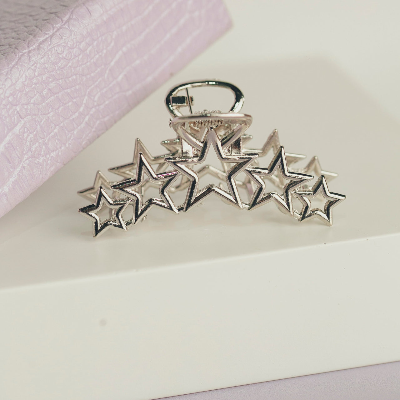 PRESILHA ESTRELA METAL OI FOFA