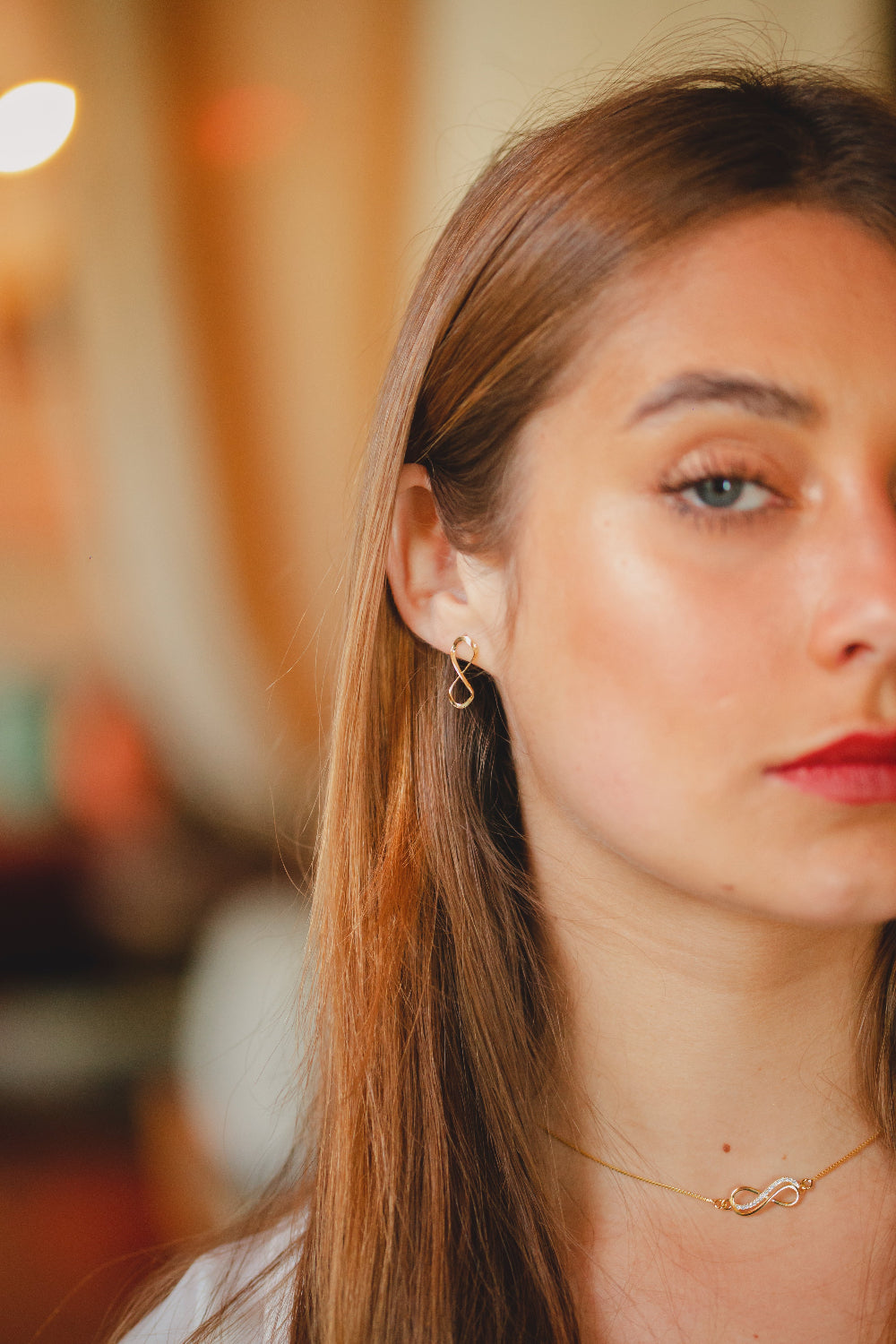 BRINCO INFINITO LISO PEQUENO FOLHEADO A OURO 18K