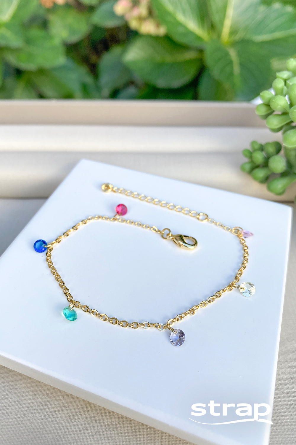 PULSEIRA COM PEDRAS COLORIDAS FOLHEADO A OURO 18K