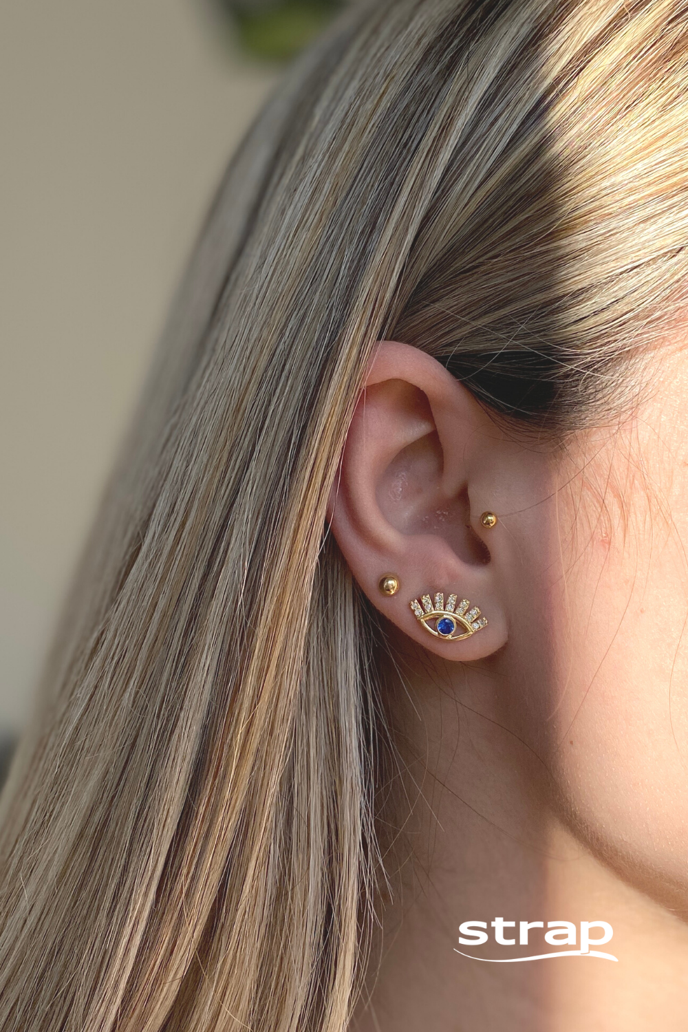 BRINCO OLHO GREGO COM ZIRCONIA AZUL FOLHEADO A OURO 18K