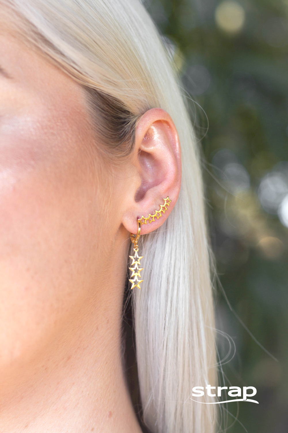 BRINCO EAR CUFF DE ESTRELAS VAZADAS FOLHEADO A OURO 18K